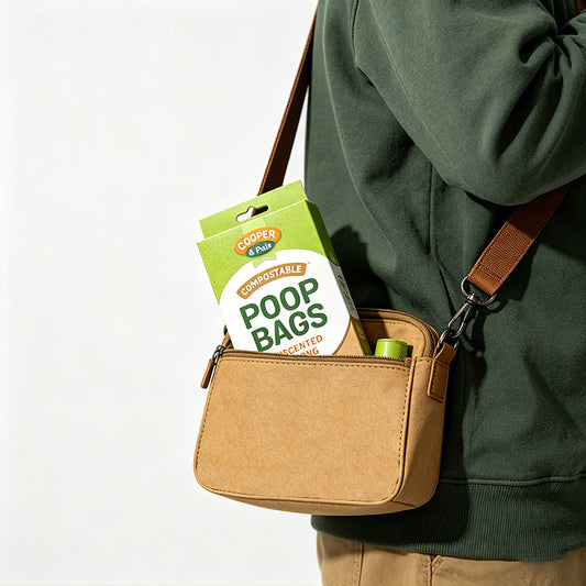 Person carrying unscented dog waste bags against a white background.